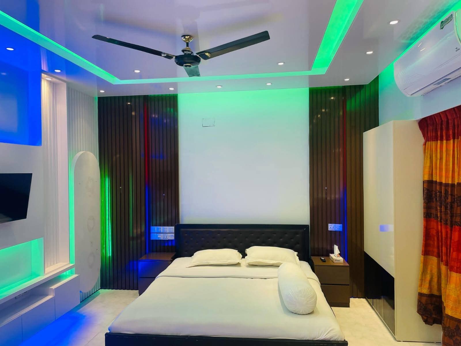 Room with green ceiling accent and mini fridge